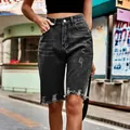 Detailed view of high-waisted distressed black denim shorts with raw hem and fringe - S / Bottoms / Black and Gray