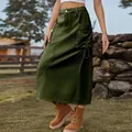 Detailed view of a retro olive green denim cargo skirt featuring a large side pocket detail - S / Bottoms / Army Green
