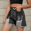 Close-up of black distressed denim shorts with tassel fringe and ripped details. - S / Bottoms / Charcoal Grey