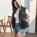 Close-up detail of a women's classic dark grey washed hooded denim vest in outdoors - S / Tops / Detachable Hood / Black Gray With Hood