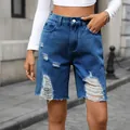 Detailed view of women's retro mid-waist distressed denim shorts with raw hems. - XL / Bottoms / Dark Blue