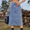 Close-up view of a stylish blue washed denim cargo midi skirt with functional side pockets - S / Bottoms / Denim Blue