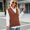 Close-up of a woman wearing a brown V-neck knit sweater vest over a white shirt. - S / Tops / Caramel color