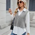 Close-up detail of a grey cable-knit V-neck sweater vest layered over a white shirt. - S / Tops / Gray