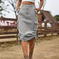 Macro detail of a grey mid-length denim cargo skirt featuring drawstring hems and pockets - 2XL / Bottoms / Light Gray
