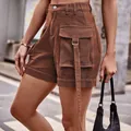 High-waisted brown denim cargo shorts with a large pocket and decorative strap - S / Brown