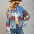 Detailed view of a Western style Aztec pattern patchwork denim jacket on a model. - S / Tops