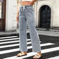 Detail of light wash denim wide-leg pants with drawstring waist and large pockets - S / Bottoms / Light Blue