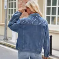 Detail view of washed denim jacket featuring white pearl embellishments on the back - S / Pearl Decorated Top / Blue