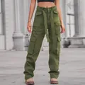 Detail of army green washed cargo pants featuring multiple flap pockets and matching belt - S / Bottoms / Army Green