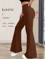 Women's high waisted brown flared yoga pants featuring elastic fabric for fitness and running - S / Bottoms / Caramel color