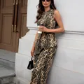 Full body shot showing the fit and leopard print detail of the sleeveless denim set. - S / Tops / Leopard Print