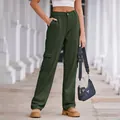 Detailed view of women's military green washed cargo pants with side pockets and high waist - S / Bottoms / Army Green