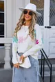 Detailed view of white knit sweater featuring colorful floral patterns and round neck - S / Tops / White