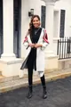 Full body shot of a model wearing a long white knit cardigan with fringe and sleeve patterns - S / Tops / White
