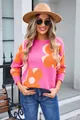 Fashion model wearing a pink round neck sweater with large orange flower patterns - S / Tops / Rose Red