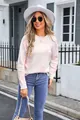 Detailed view of women's white round neck knitted sweater with pink floral pattern - S / Tops / White