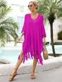 Full body view of a fuchsia knit beach cover-up with fringe hem in a resort setting - One Size / Tops / Rose Red