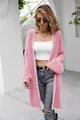 Detailed view of women's long pink fuzzy cardigan with stylish chevron knit pattern - Watermelon red