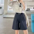 Stylish high-waist casual shorts for women featuring a minimalist belt detail. - Navy Blue