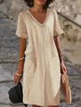 Elegant beige cotton linen V-neck dress featuring unique neckline embroidery and side pockets - S / Dresses / Turmeric