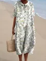 Detail van vintage bloemige lange jurk met elegante Peter Pan-kraag op het strand - XS / Pastoraal Klein Bloemenjurkje (Stijl 10)