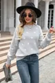 Detail shot of light gray sweater with white polka dot pattern and ribbed cuffs - S / Tops / Gray
