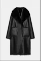 Full-length view of a black reversible shearling coat with a luxurious faux fur collar. - XS / Tops / Black