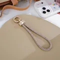 Luxury rhinestone wrist strap lanyard with elegant bow-tie charm and gold-tone metal clasp - Charm / Bow 10-Row Rhinestone Chain Charm (K5759) / Champagne