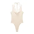 Detailed view of cream halter neck bodysuit with delicate lace trim - Beige