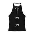 Elegant black halter neck top featuring three sparkling rhinestone bow accents for summer - XS / Tops / Black
