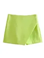 Detailed macro shot of neon green asymmetric high-waist skorts showing fabric texture - S / Bottoms / Goose Yellow