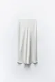 Detail view of the elegant satin texture and fluid drape of this white midi skirt - XS / Bottoms / White