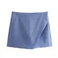 Detailed close-up of a light blue asymmetric high-waisted skort with minimalist design. - Blue