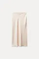 Elegant champagne satin midi skirt featuring high waist design and luxury silk-like drape texture - Off White