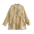 Detailed macro view of tie-dye silk satin shirt featuring elegant mandarin collar design. - XS / Tops