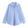 Close-up detail view of a classic blue and white vertical striped shirt with buttons - XS / Tops / Blue