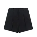 Detailed macro view of women's black linen blend high-waisted pleated summer shorts - XS / Bottoms / Black
