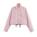Detailed view of a pink jacket with black polka dots and a drawstring hem - S / Tops / Pink
