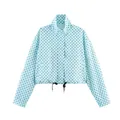 Close-up detail of a light blue polka dot cropped windbreaker jacket with adjustable drawstring - S / Tops / Blue