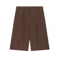 Detailed view of brown linen casual mid-waist wide-leg shorts with pleated design - XS / Bottoms / Brown