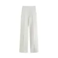 Vue de face d'un élégant pantalon blanc à taille haute et jambes larges avec plis. - XS / Bas / Blanc