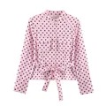 Close-up of pink polka dot shirt with breast pockets and waist tie detail. - XS / Tops / Pink Polka Dot