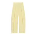 Detalle de pantalones globo plisados de cintura alta en un elegante tejido amarillo pálido. - XS / Bottoms / Amarillo