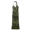 Detail view of a green tie-dye midi dress featuring red polka dots and a matching neck tie. - XS / Dresses / Olive Green