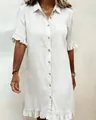Detail shot of off-white denim shirt dress featuring ruffled sleeves and button closure. - S / Dresses / White