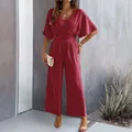 Full-length detail of a burgundy V-neck short sleeve wide-leg jumpsuit in crinkle textured fabric - Burgundy