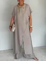 Dettaglio del set top asimmetrico e pantaloni a gamba larga in finto lino kaki - Taglia S / Parte Superiore e Parte Inferiore / grigio-argento
