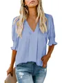 Detailed view of women's loose light blue V-neck blouse with smocked cuffs - S / Tops / Light Green