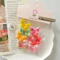 Primer plano de coloridos dijes de resina de mariposa con temática frutal para manualidades - Tipo Magnético (Con Cabecera de Tarjeta) / Juego de 8